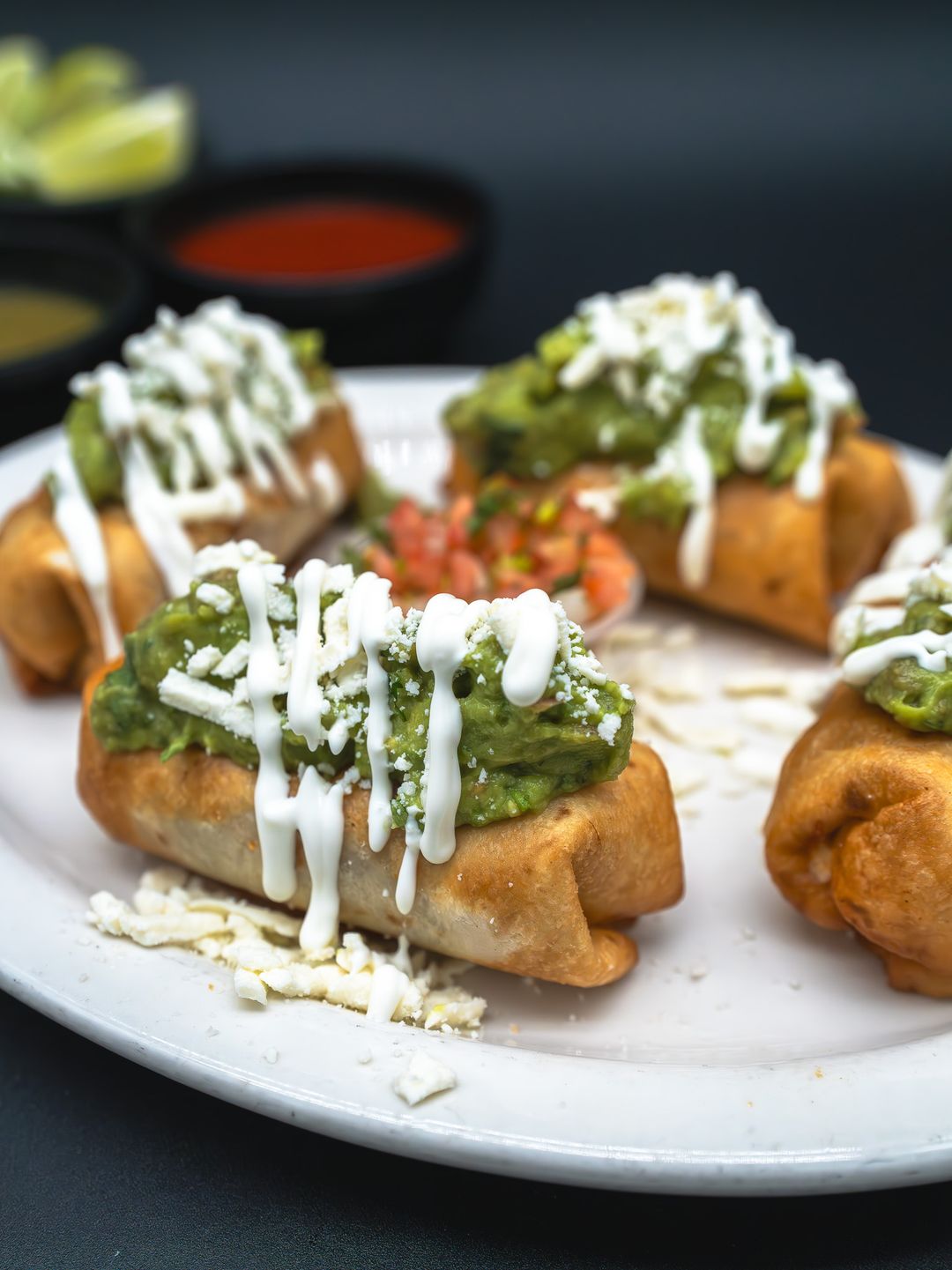 Taquitos with guacamole, crema and cotija